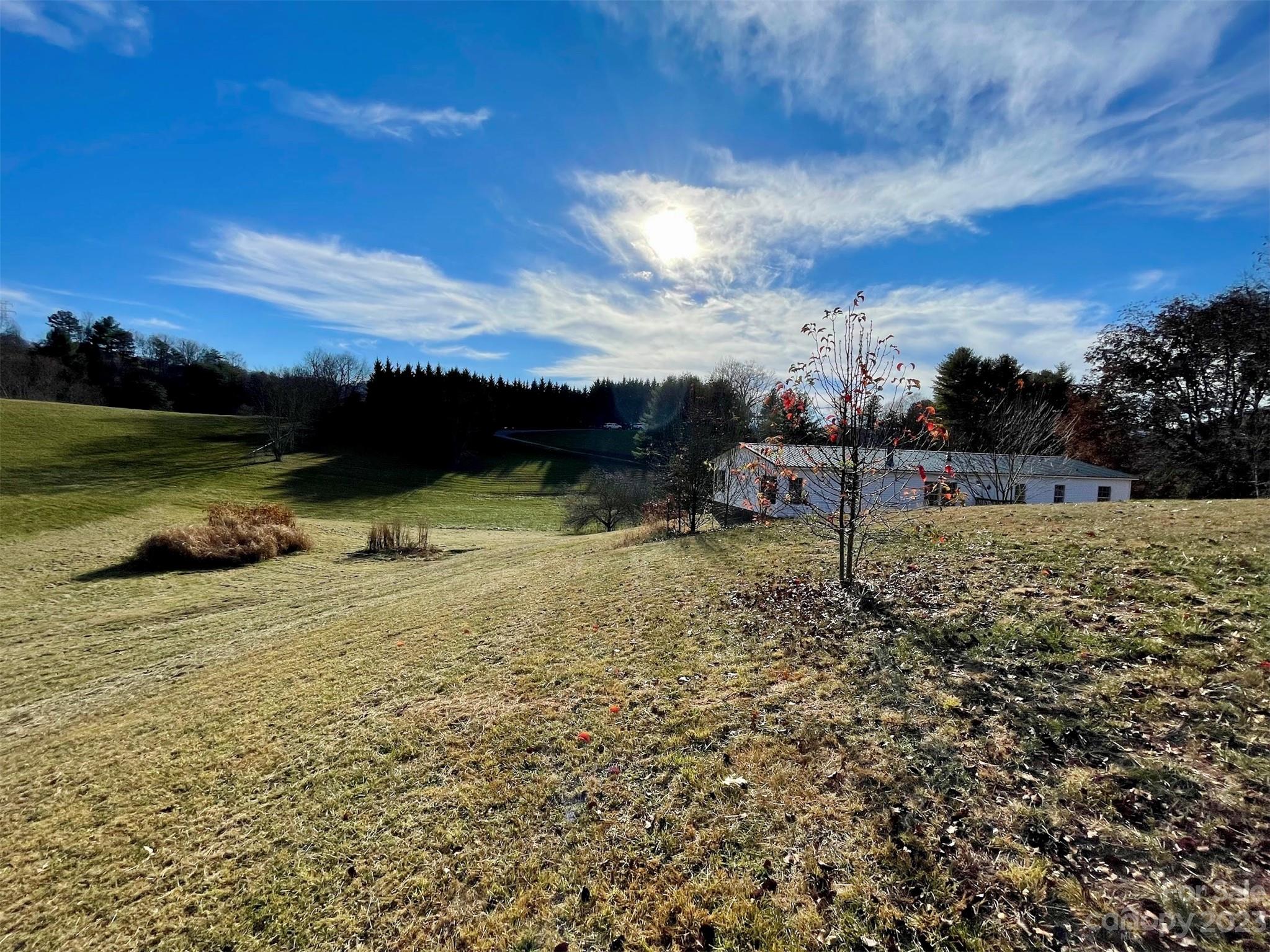 570 Scottdale Road Canton, NC 28716 - Photo 40 of 44 a view of a lake with a big yard