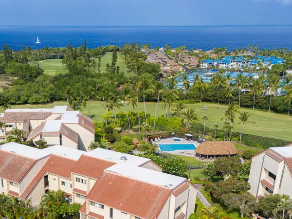 an aerial view of residential house with outdoor space and swimming pool
