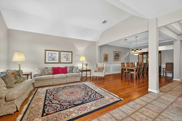 a living room with furniture and a rug