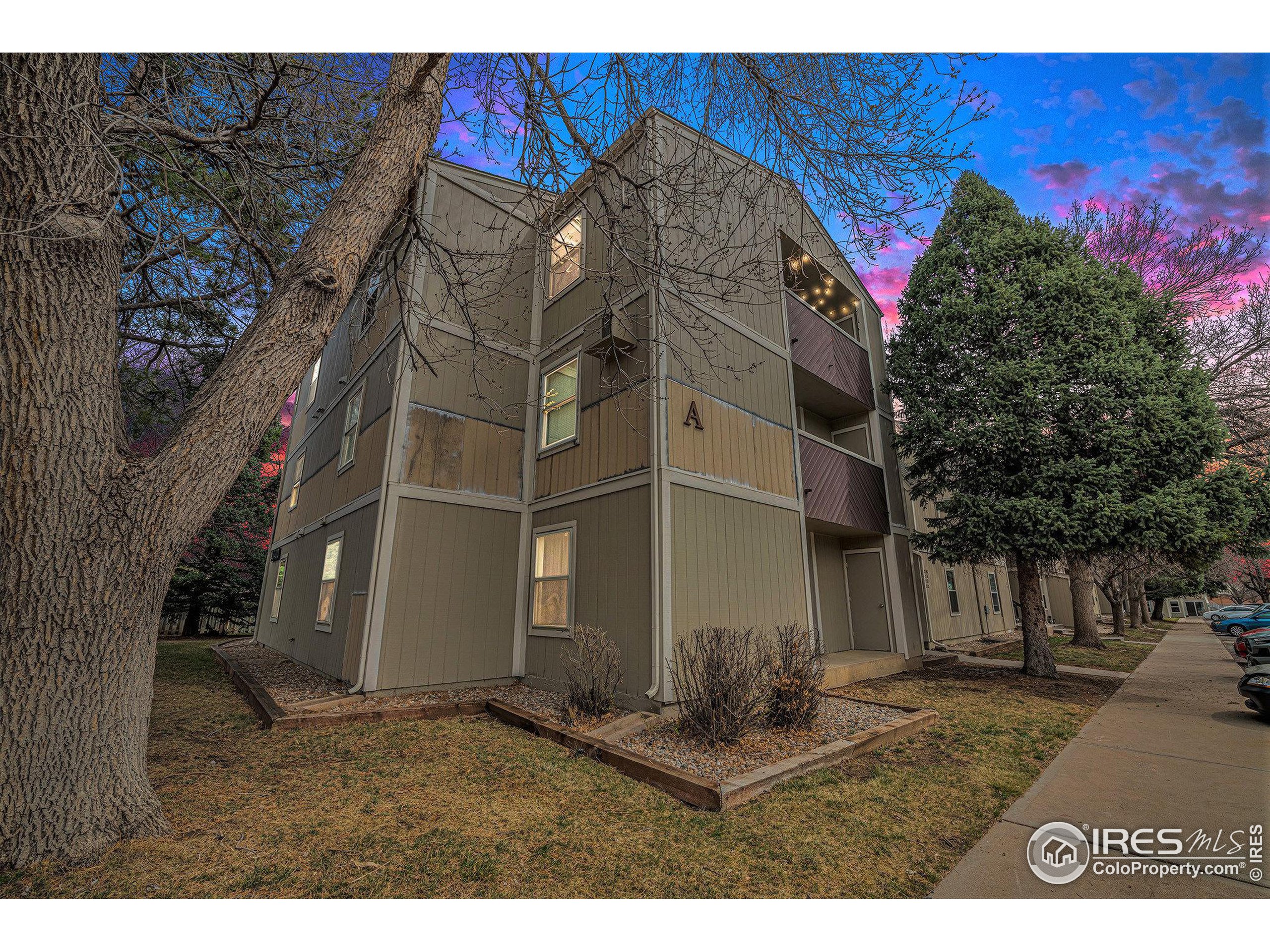 3400 Stanford Road, Unit A120 Fort Collins, CO 80525 - Photo 16 of 16 a view of a house with a yard