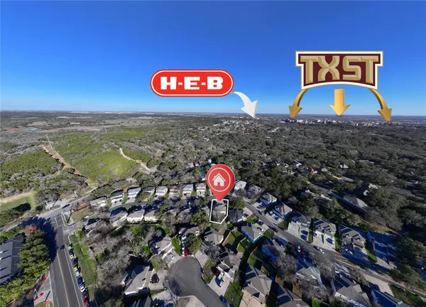 an aerial view of multiple house with yard