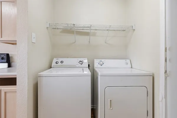 a utility room with dryer and washer