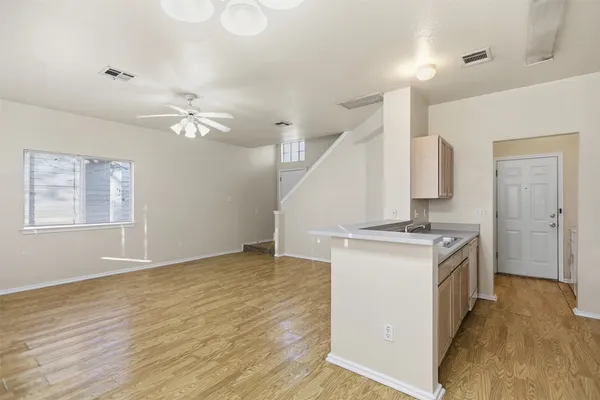 a view of backyard with wooden fence