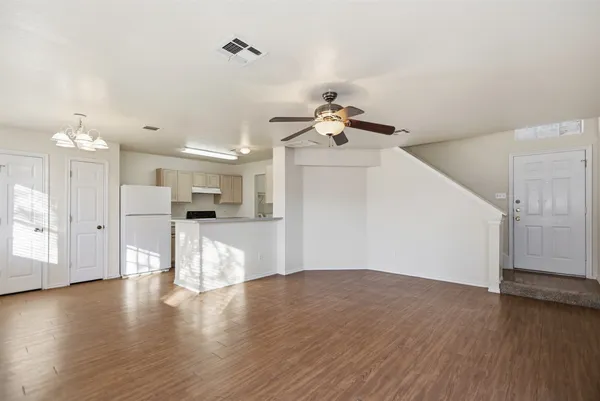 a view of a livingroom with wooden floor