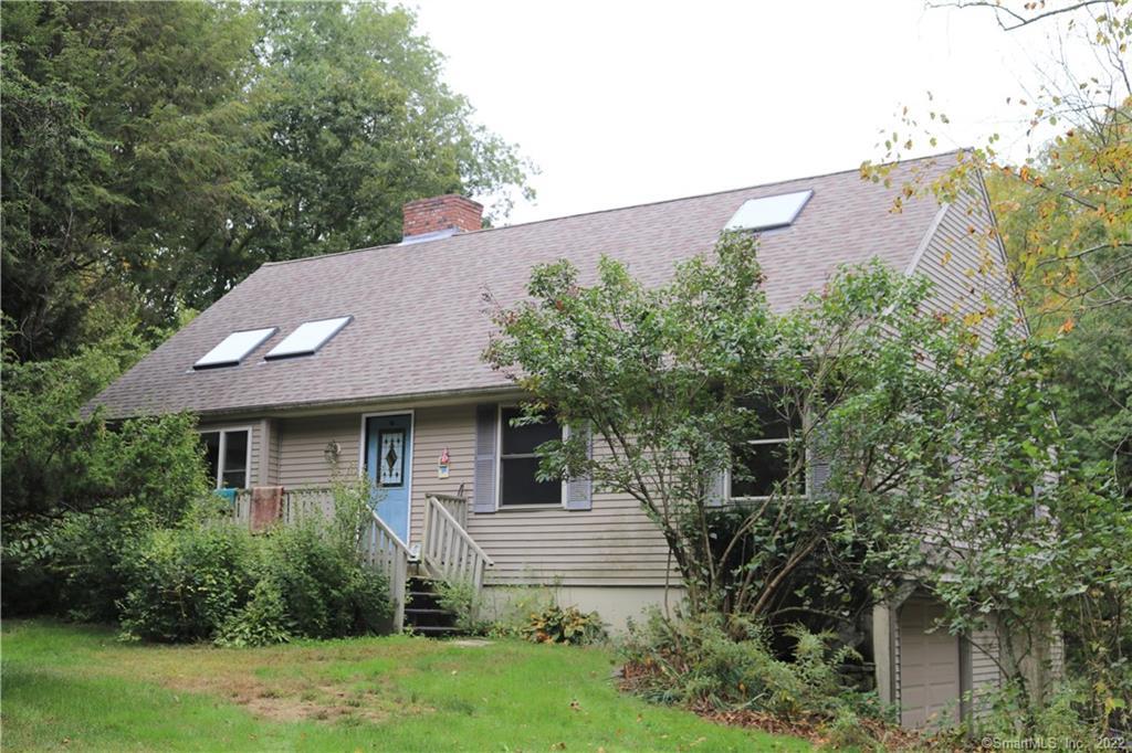 189 Flanders Road Bethlehem, CT 06751 - Photo 1 of 1 Front of home showing three skylights - two in the living room with a cathedral and a third in the master bedroom on the upper level.