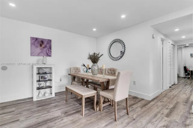 a view of a room with furniture and wooden floor