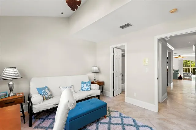 a living room with furniture and a lamp