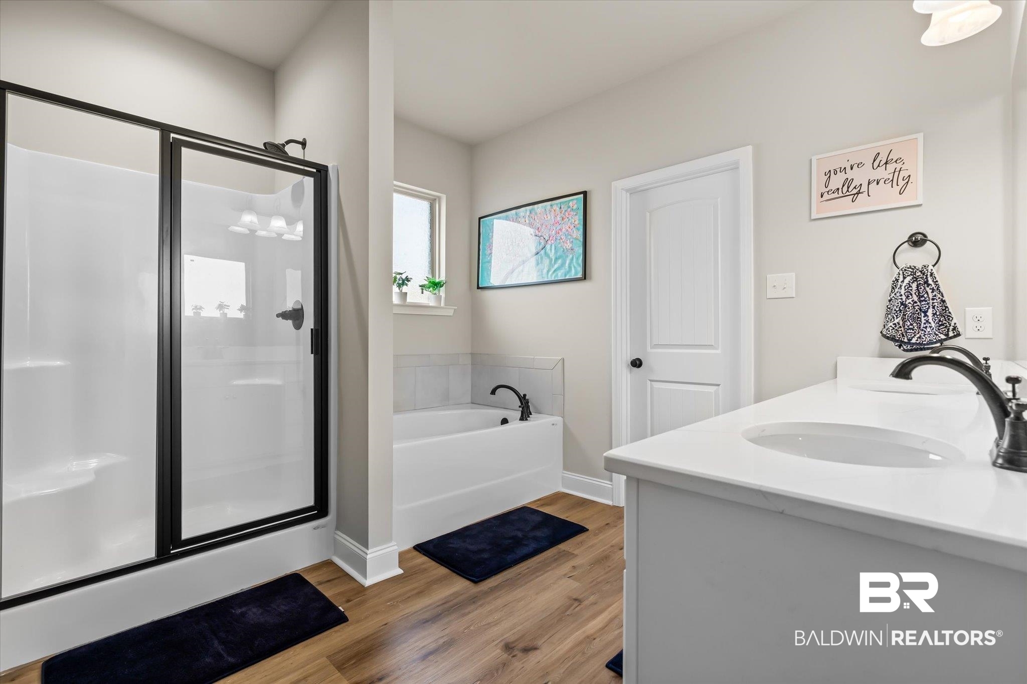 1116 Stella Road Foley, AL 36535 - Photo 14 of 29 Bathroom with separate shower and tub, hardwood / wood-style floors, and vanity