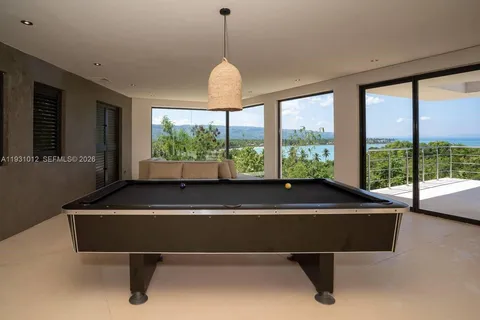 a dining table with kitchen view