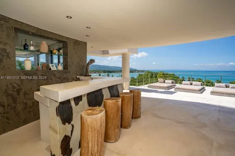 a bedroom with a large bed and a large window