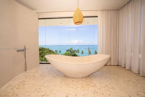 a view of outdoor room with wooden floor and fan