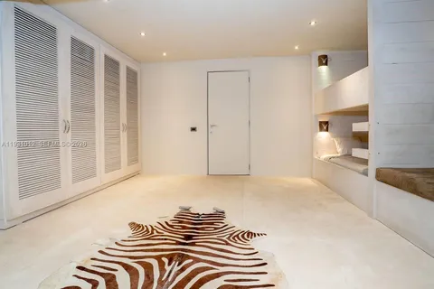 a bed room with a bed and a night stand