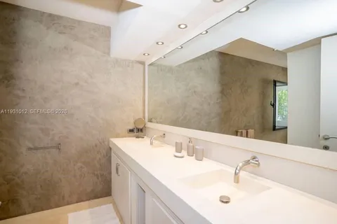 a bedroom with a bed and a lamp