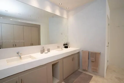 a bedroom with a large bed and a couch