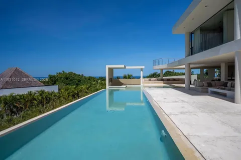 a view of a patio with swimming pool table and chairs