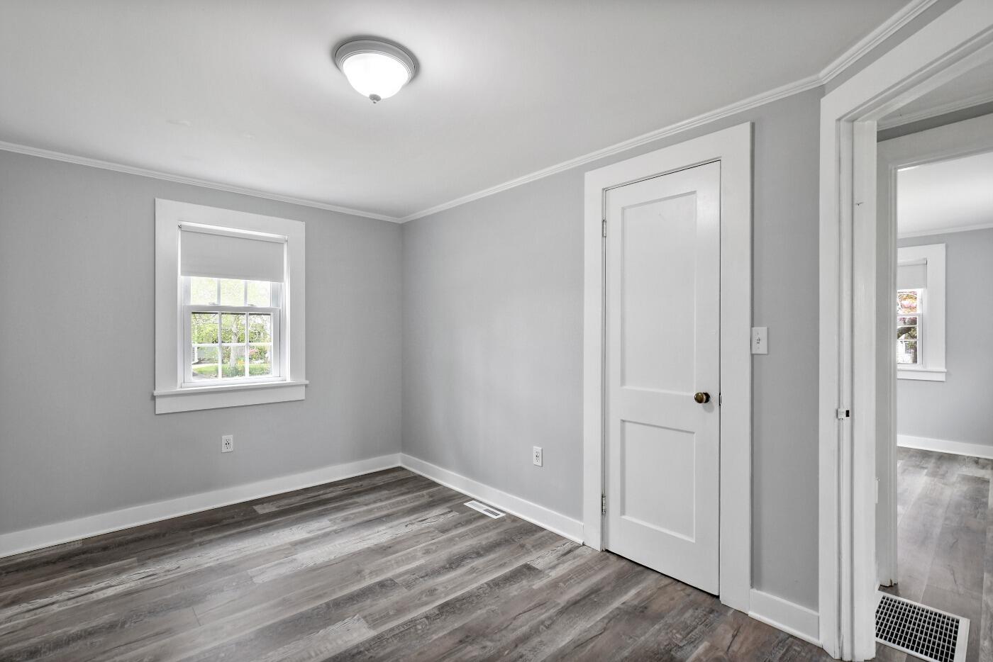 1 Gilbert Road Dennis Port, MA 02639 - Photo 17 of 27 an empty room with wooden floor and windows