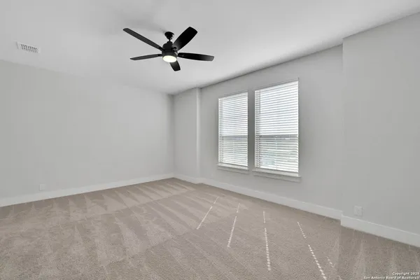 a view of room with ceiling fan