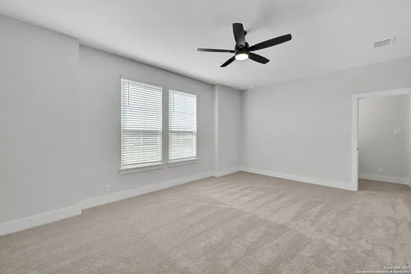 a bathroom with a sink a mirror and shower