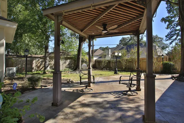 a view of a swimming pool with a patio