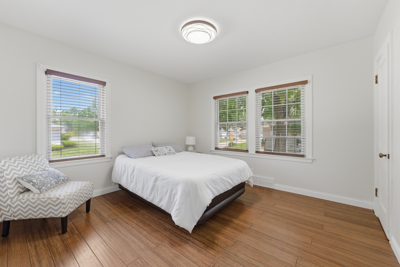 2405 31st Street Moline, IL 61265 - Photo 10 of 24 a large bed sitting in a bedroom next to a window