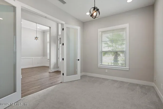 a view of a kitchen counter space a sink and wooden floor
