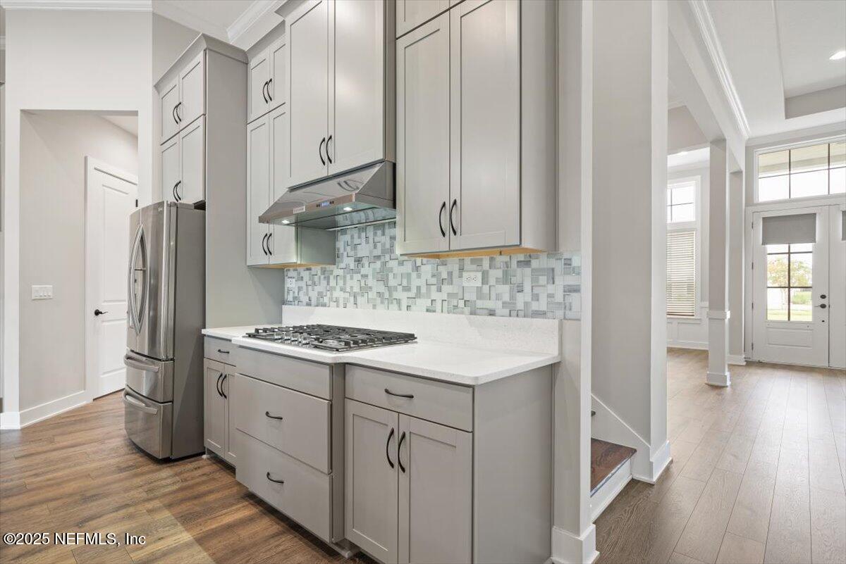 141 Topside Dr. St. Johns, FL 32259 - Photo 19 of 71 a kitchen with stainless steel appliances granite countertop a sink stove and refrigerator