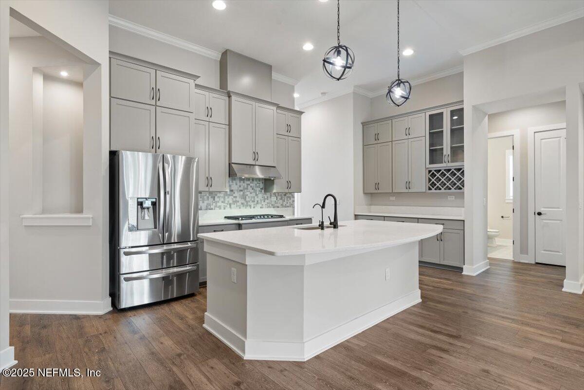 141 Topside Dr. St. Johns, FL 32259 - Photo 21 of 71 a kitchen with stainless steel appliances granite countertop a sink a refrigerator and a stove