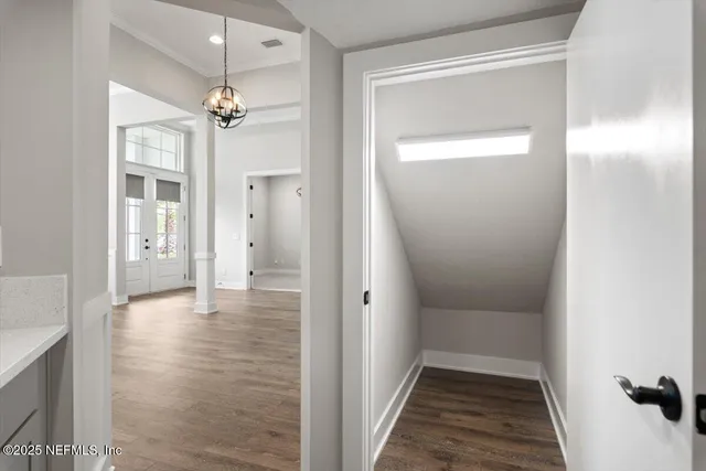 a bathroom with a bathtub sink and mirror