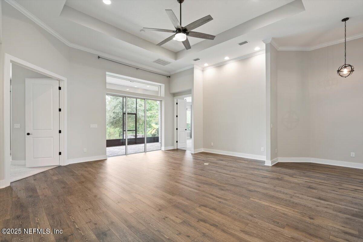 141 Topside Dr. St. Johns, FL 32259 - Photo 29 of 71 a view of an empty room with wooden floor and a window