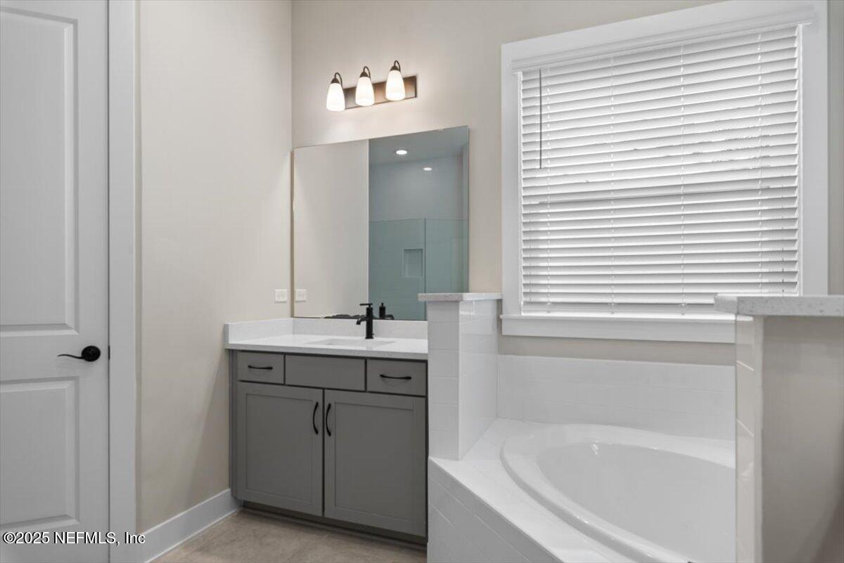141 Topside Dr. St. Johns, FL 32259 - Photo 35 of 71 a bathroom with a bathtub sink and mirror