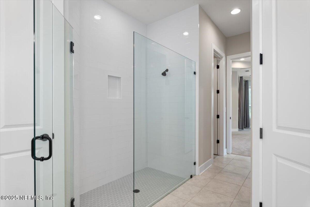 141 Topside Dr. St. Johns, FL 32259 - Photo 36 of 71 a bathroom with a glass shower door