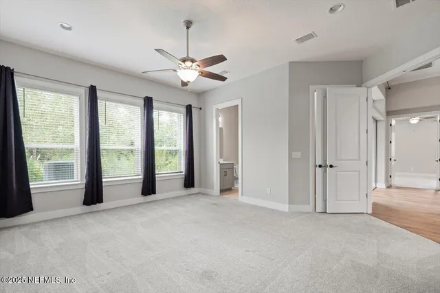 a view of a back yard from a balcony