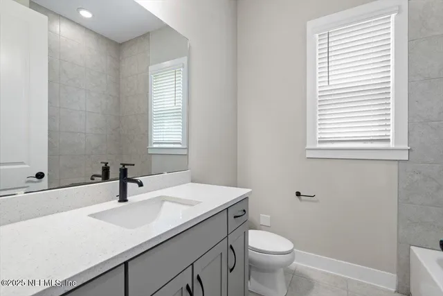 a view of swimming pool with a garden and outdoor seating