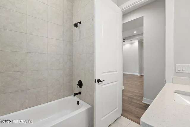 an aerial view of a house with swimming pool and porch