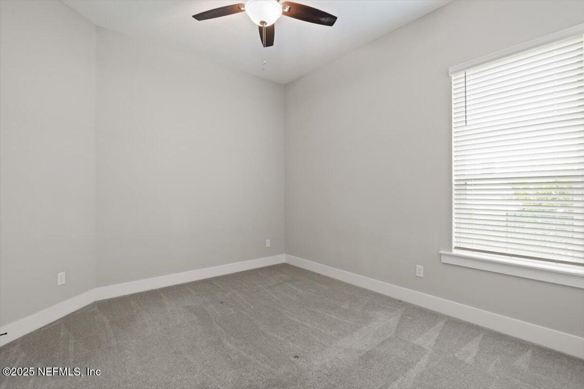 141 Topside Dr. St. Johns, FL 32259 - Photo 46 of 71 an empty room with a window and a fan