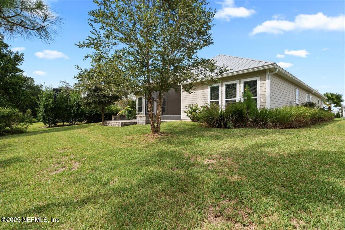 141 Topside Dr. St. Johns, FL 32259 - Photo 57 of 71 a front view of a house with garden