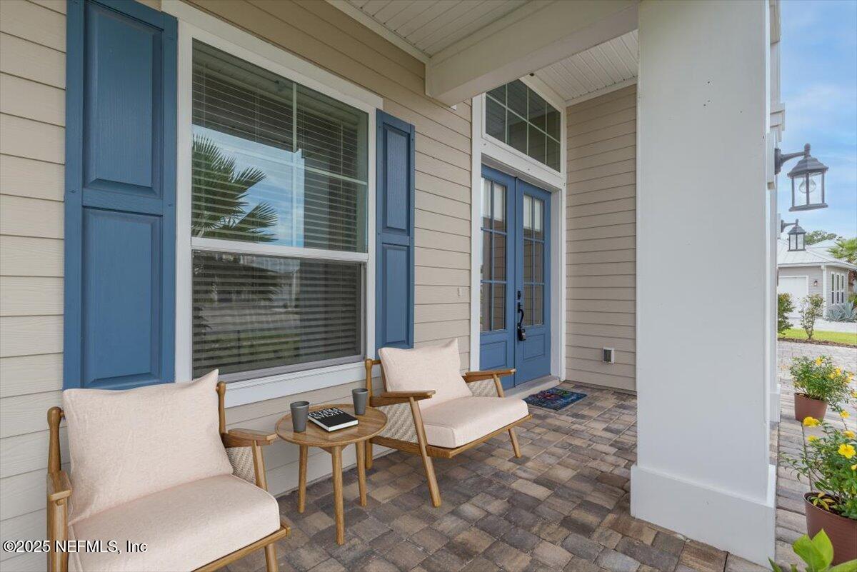 141 Topside Dr. St. Johns, FL 32259 - Photo 6 of 71 a view of a patio with couple of chairs and a potted plant