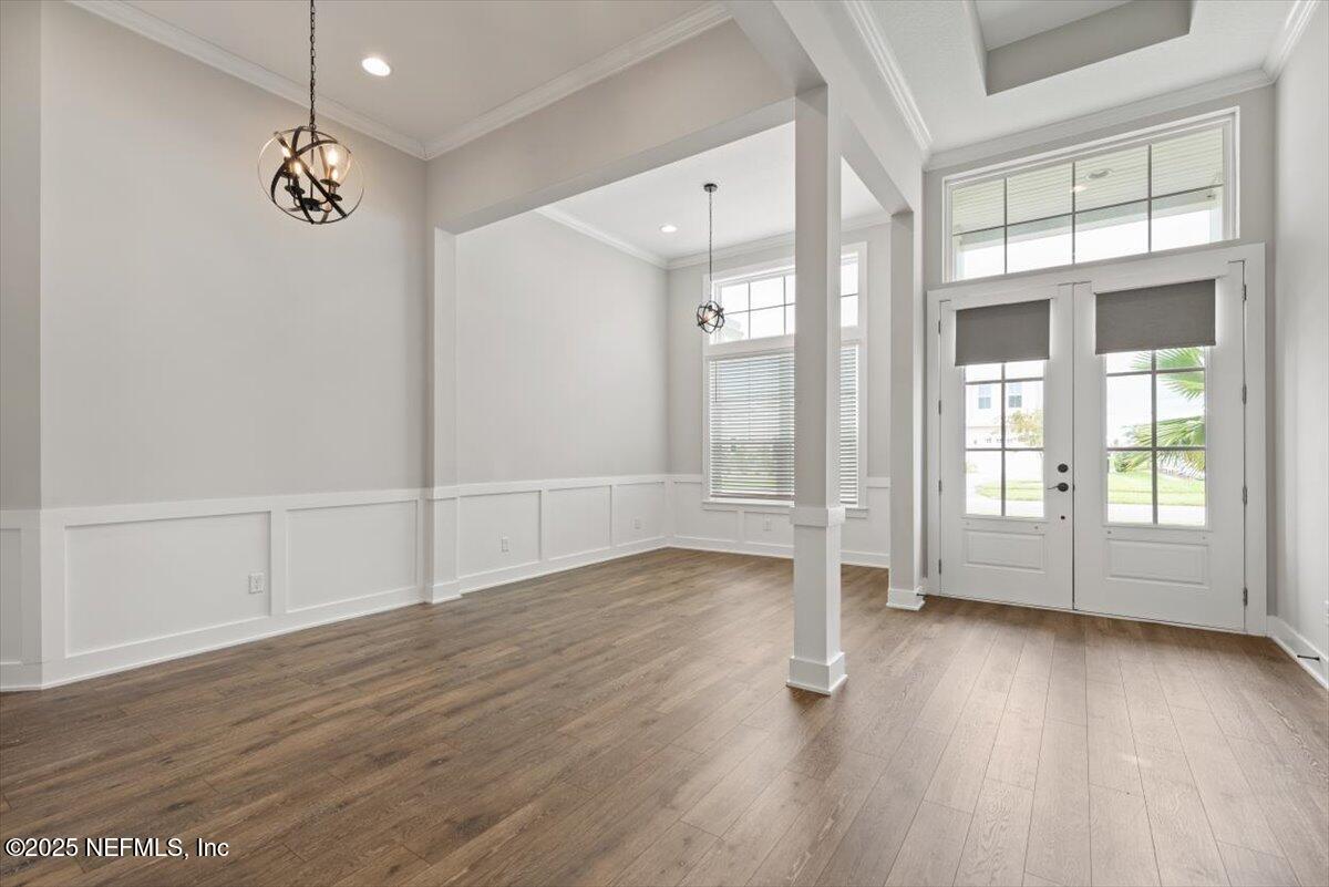 141 Topside Dr. St. Johns, FL 32259 - Photo 8 of 71 a view of an empty room with wooden floor and a window