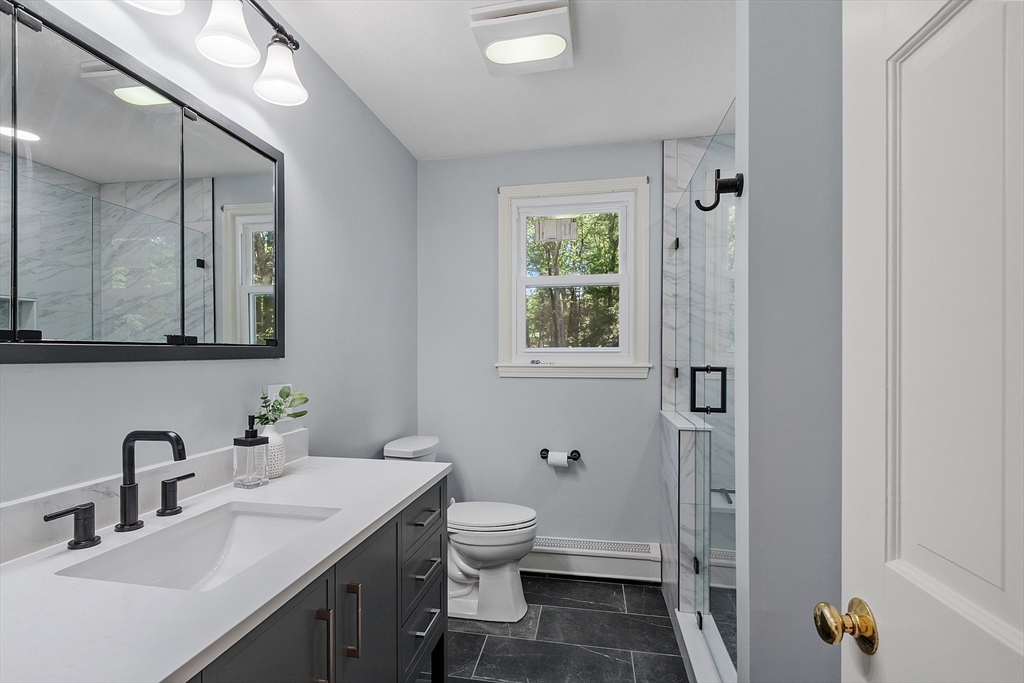 6 Candida Lane Acton, MA 01720 - Photo 20 of 37 a bathroom with a granite countertop sink toilet and shower