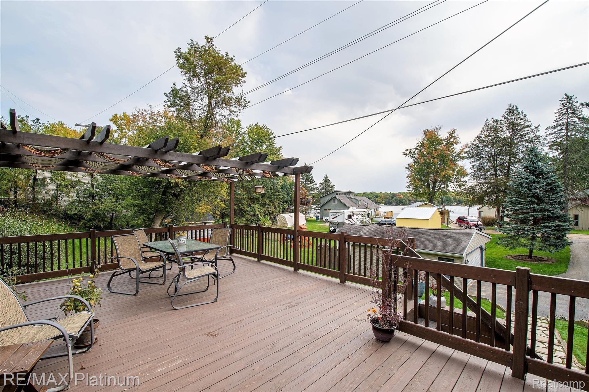 8250 Tipsico Lake Road Holly, MI 48442 - Photo 22 of 29 PRIVATE DECK W/ GREAT VIEWS OF THE LAKE