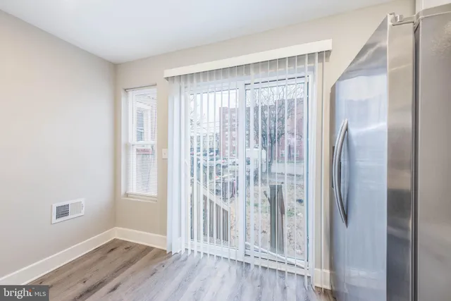 a view of entryway with wooden floor