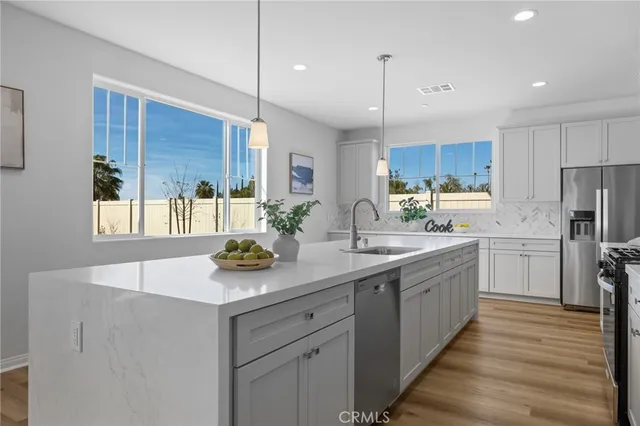 a bedroom with a bed and painting on the wall