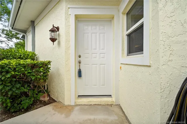a view of tennis ground with trees in the background