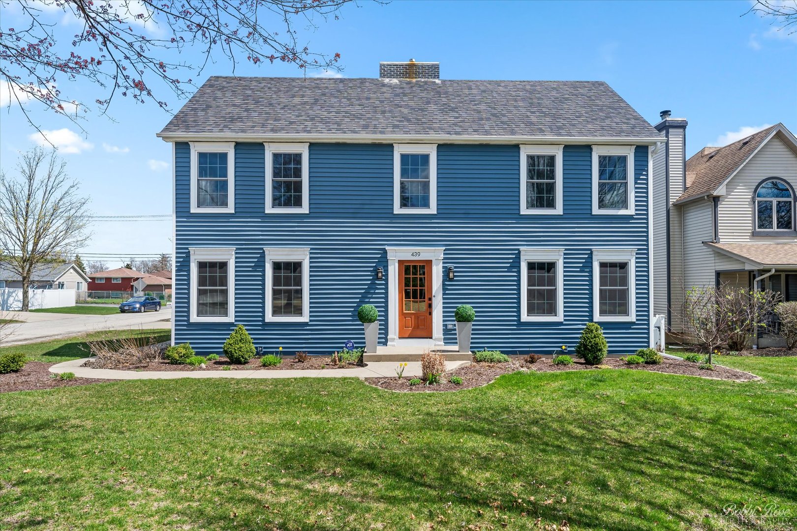 a front view of a house with a yard
