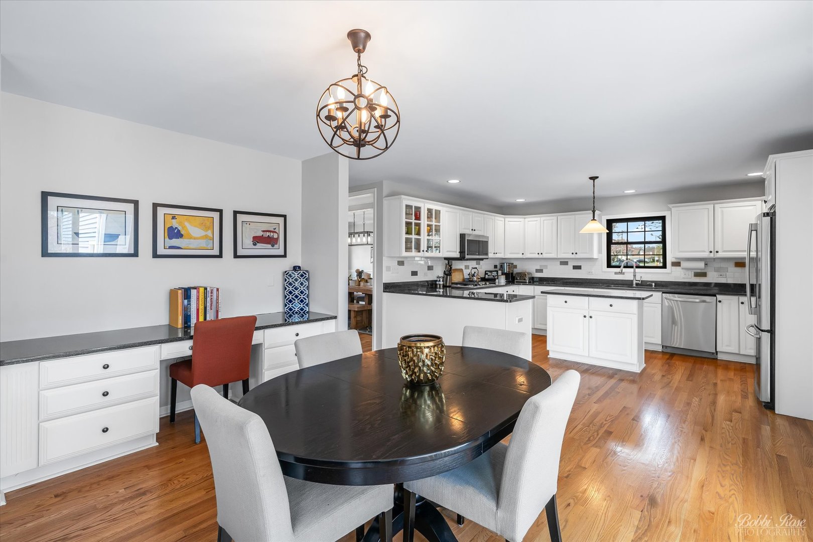 439 South Church Road Bensenville, IL 60106 - Photo 14 of 49 a large kitchen with a table and chairs