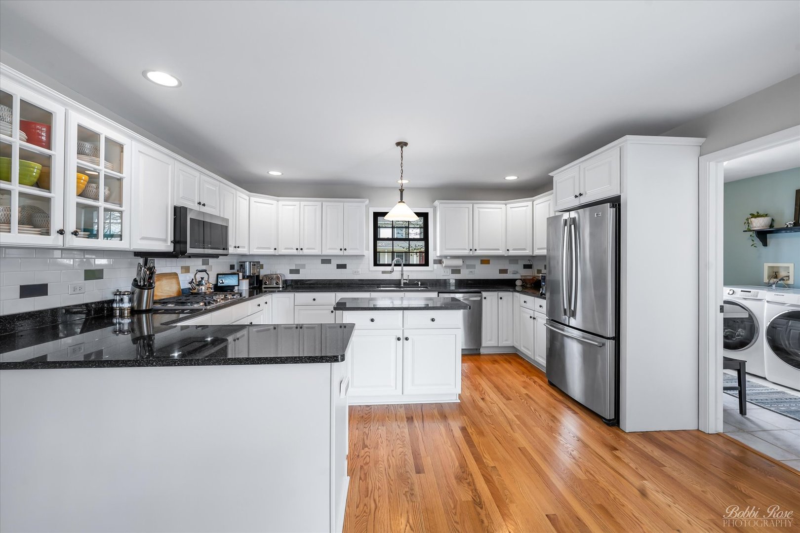 439 South Church Road Bensenville, IL 60106 - Photo 16 of 49 a kitchen with stainless steel appliances granite countertop a refrigerator a stove top oven a sink dishwasher and wooden cabinets