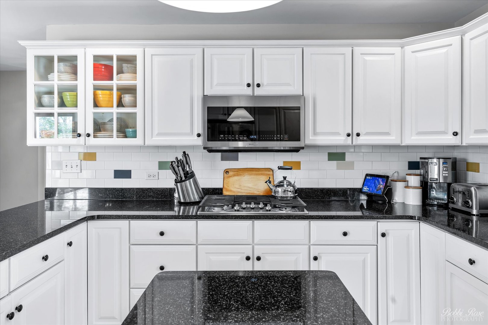 439 South Church Road Bensenville, IL 60106 - Photo 19 of 49 a kitchen with granite countertop white cabinets and white appliances
