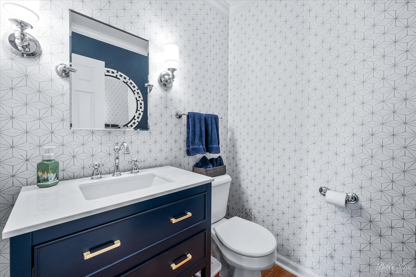 439 South Church Road Bensenville, IL 60106 - Photo 20 of 49 a bathroom with a sink toilet and mirror