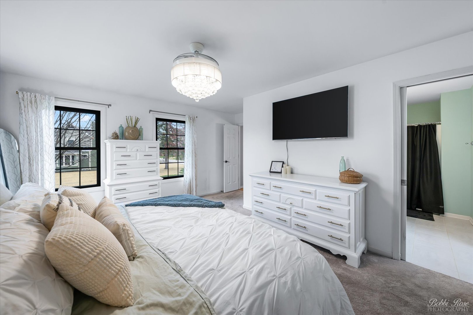 439 South Church Road Bensenville, IL 60106 - Photo 24 of 49 a bedroom with a bed and a flat screen tv