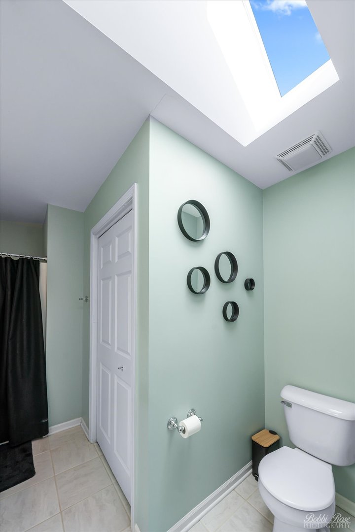 439 South Church Road Bensenville, IL 60106 - Photo 26 of 49 a bathroom with a toilet and a shower